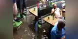   YouTube: Clientes sorprenden con inusual reacción en un bar que se inundaba [VIDEO]