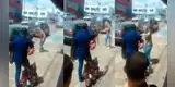 Mujer golpea en la calle a su esposo y ambulante aprovecha para venderle una correa [VIDEO]