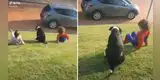 Niños juegan con su perro a deslizarse por el pasto y escena enternece a miles [VIDEO]