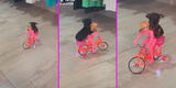 ¡Todo un ciclista! Joven pasea a su perrito en una bicicleta de juguete y tierno video es viral