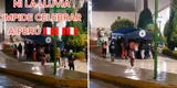 Hinchas peruanos celebran el triunfo de Perú bajo la lluvia y se cubren con toldo del Minsa [VIDEO]