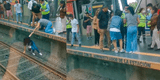 Metro de Lima: Joven se desmaya cerca a los rieles del tren y usuarios la auxilian