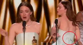 Emma Stone recibe su estatuilla con el vestido roto.
