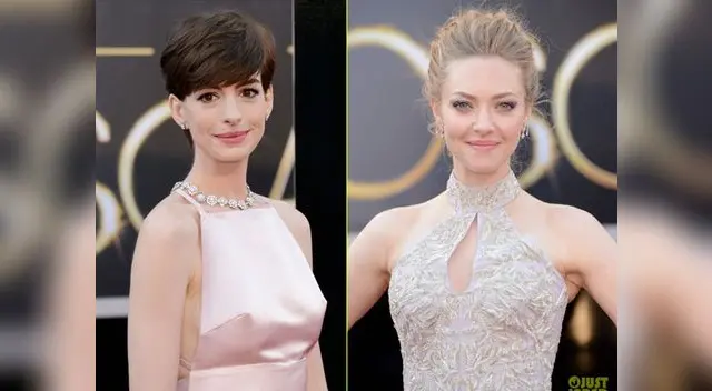 Anne Hathaway (Prada) y Amanda Seyfried (Valentino) en la alfombra roja del Oscar 2013.