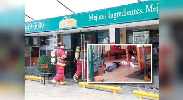 Bomberos y rescatistas llegaron al local de la cadena de pizzas y encontraron a los trabajadores tirados en el piso.