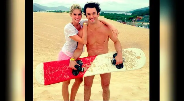 Lo olvida con gimnasta brasileño Diego Hypólito, con quien goza en playa. Lo olvida con gimnasta brasileño Diego Hypólito, con quien goza en playa.