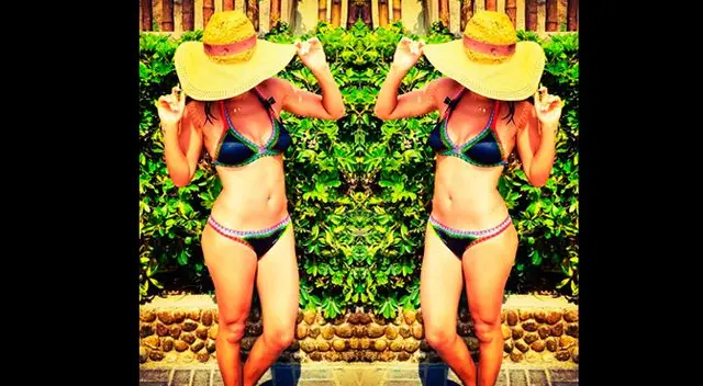 Angie luce el resultado de su rutina de ejercicios. Angie luce el resultado de su rutina de ejercicios.