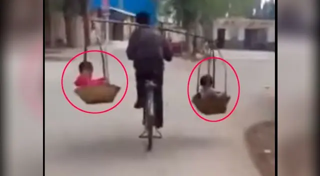 El padre se desplazaba en su bicicleta El padre se desplazaba en su bicicleta