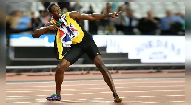 Bolt en su clásica pose para las fotos Bolt en su clásica pose para las fotos