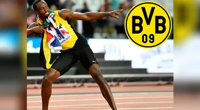 Usain Bolt con el escudo del Borussia Dortmund
