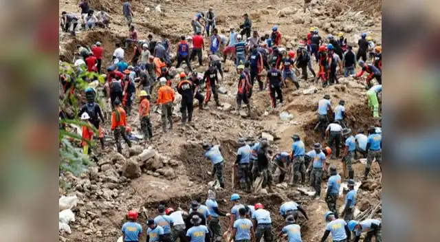 Rescatistas buscan cuerpos de personas enterradas tras paso del tifón Mangkhut