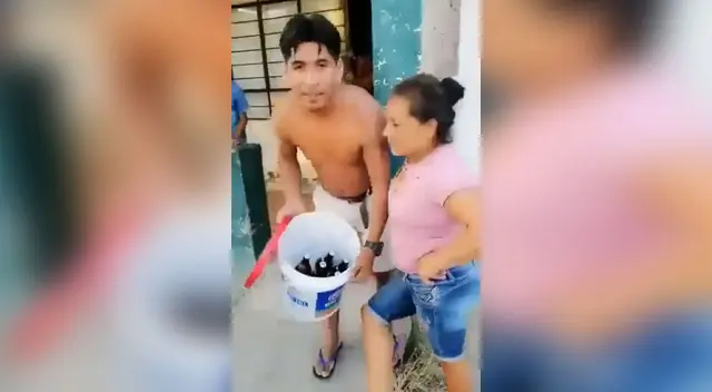 Familia compra cerveza pese a ser el día de inmovilización total decretada por el gobierno. Familia compra cerveza pese a ser el día de inmovilización total decretada por el gobierno.