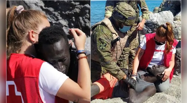 España: migrante marroquí es abrazado por voluntaria de la Cruz Roja tras llegar nadando hasta Ceuta.