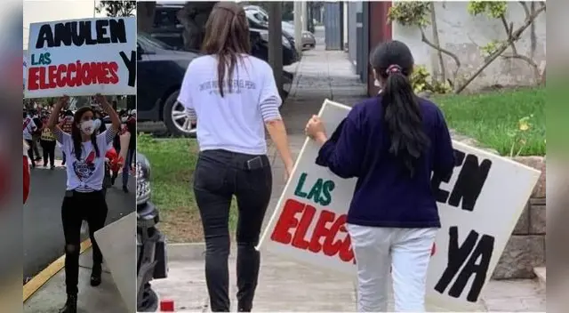 La persona fue captada junto a su trabajadora del hogar donde se ve a esta ultima cargando el cartel que utilizó la mujer para protestar.