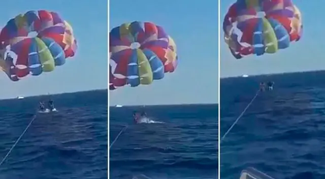 El hombre volaba en parapente en el Mar Rojo. El hombre volaba en parapente en el Mar Rojo.