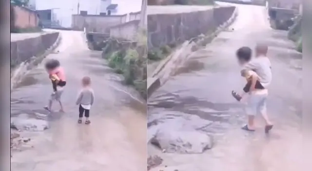 Niño carga a sus hermanitos para que puedan cruzar un charco de agua y no se mojen los pies. Foto: captura de TikTok.