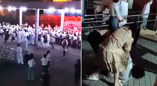 Cientos de trabajadores de una fábrica de tecnología atravesaron las barreras y se agarraron a golpes con los guardias que intentaron mantenerlos adentro. Cientos de trabajadores de una fábrica de tecnología atravesaron las barreras y se agarraron a golpes con los guardias que intentaron mantenerlos adentro.