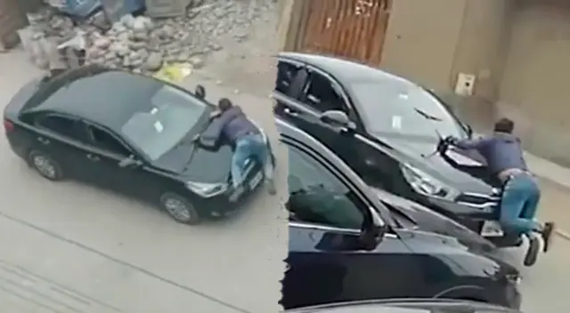 Momento exacto en el que conductor se trepa en el capot de su auto que era robado por delincuentes
