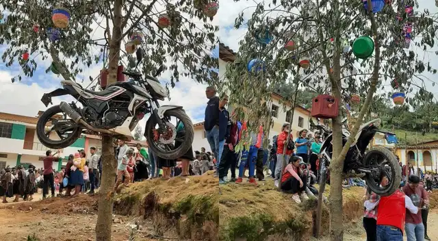 Motocicleta colgada en yunza realizada por carnavales en Huánuco