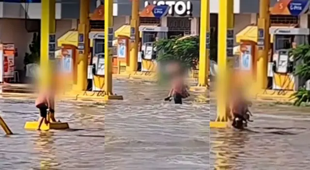 Cargó al can para atravesar la avenida inundada.