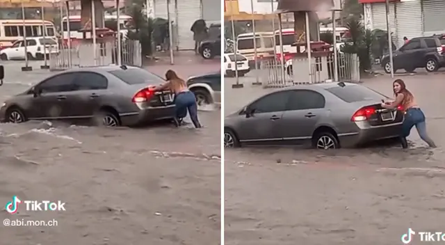 La joven empujó el carro que estaba atascado.