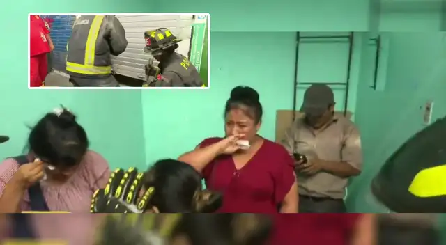 Comerciantes siendo rescatados por los bomberos Comerciantes siendo rescatados por los bomberos