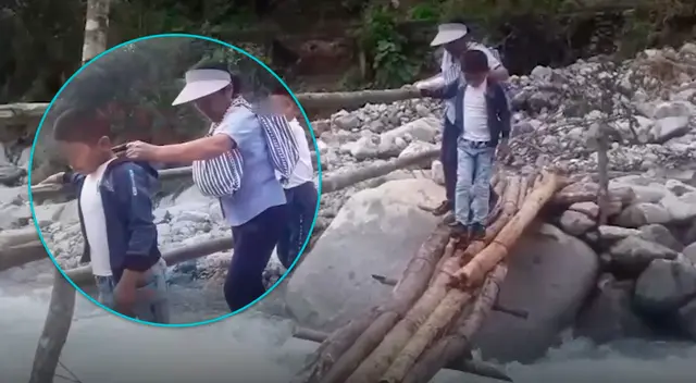 Niños exponen sus vidas al cruzar río de Piura para asistir a clases. Niños exponen sus vidas al cruzar río de Piura para asistir a clases.