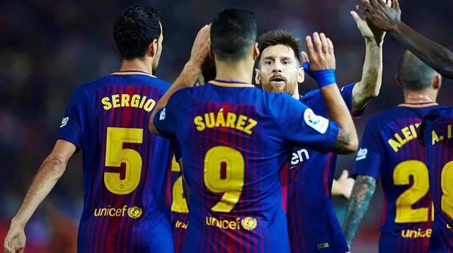 Messi celebra con Suárez