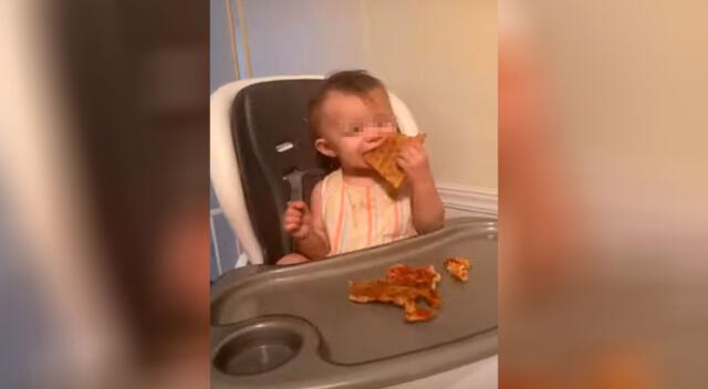 Bebé tiene curiosa reacción al comer un pedazo de pizza por primera vez