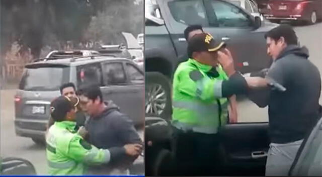 Efectivo policial peleando con taxista