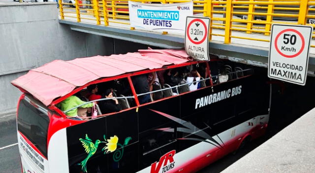 Bus de Panoramic Bus atrapado en el puente de Javier prado y la avenida de Arequipa.